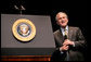 President George W. Bush reacts while taking questions from the audience Monday, May 22, 2006, following his remarks on the War on Terror to the National Restaurant Association gathering at Chicago's McCormick Place. White House photo by Eric Draper