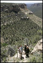 Mrs. Laura Bush pauses for a photo while hiking in Mesa Verde National Park in Colorado with, from left, Lynn Scarlett, Acting Secretary of the U.S. Department of Interior, Fran Mainella, Director, National Park Service and Larry Wiese, Superintendent of Mesa Verde National Park on Tuesday, May 23, 2006. Mesa Verde, founded as a national park on June 29, 1906, is celebrating its Centennial Anniversary this year. White House photo by Shealah Craighead