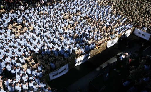 Some of the over 4,000 sailors and Marines gather aboard the USS Bonhomme Richard as they watch and listen to Vice President Dick Cheney as he praised the men and women of Expeditionary Strike Group 1 for their humanitarian relief work following the earthquake in Pakistan and the tsunami in South Asia. White House photo by David Bohrer