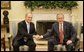 President George W. Bush exchanges handshakes with Prime Minister Ehud Olmert of Israel during their meeting Tuesday, May 23, 2006, in the Oval Office. White House photo by Eric Draper