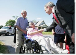 President George W. Bush meets with residents during a surprise stop in a Pottstown, Pa., neighborhood Wednesday, May 24, 2006 , after his visit to the nearby Limerick Generating Station in Limerick, Pa. White House photo by Kimberlee Hewitt