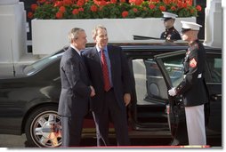 President George W. Bush welcomes British Prime Minister Tony Blair to the White House prior to their joint news conference Thursday evening May 25, 2006 in the East Room of the White House. White House photo by Eric Draper