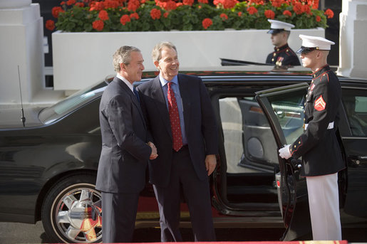 President George W. Bush welcomes British Prime Minister Tony Blair to the White House prior to their joint news conference Thursday evening May 25, 2006 in the East Room of the White House. White House photo by Eric Draper