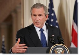 President George W. Bush speaks to the audience Thursday night, May 25, 2006, in the East Room during a joint press availability with Prime Minister Tony Blair of Great Britain. Said the President about Iraq's new government, "As we celebrate this historic moment, it's important to recall how we got there, and take stock in how far we've come." White House photo by Shealah Craighead