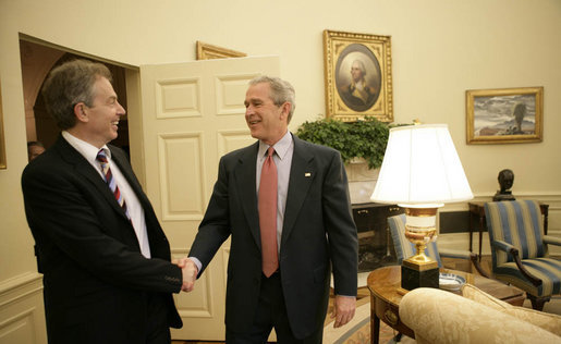 President George W. Bush greets Prime Minister Tony Blair of Great Britain in the Oval Office of the White House, Friday, May 26, 2006, during the second day of the Prime Minister's two-day visit. White House photo by Eric Draper