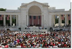 President George W. Bush addresses the thousands of people who gathered to pay their respects on Memorial Day at the Arlington National Cemetery amphitheatre in Arlington, Va., Monday, May 29, 2006. White House photo by Shealah Craighead