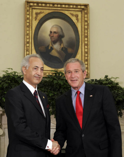 President George W. Bush exchanges handshakes with Samir Sumaidaie, Iraq's Ambassador to the United States, after receiving his credentials during an Oval Office ceremony Tuesday, May 30, 2006. Ambassador Sumaidaie is the first ambassador of a freely-elected, democratic Iraqi Government in decades. White House photo by Paul Morse