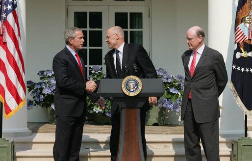 President George W. Bush shakes the hand of Henry Paulson after nominating him Tuesday, May 30, 2006, as Treasury Secretary to replace Secretary John Snow, right, who announced his resignation. White House photo by Shealah Craighead