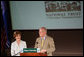 Mrs. Laura Bush listens to Richard Moe, President of the National Trust for Historic Preservation, Wednesday, May 31, 2006. Mr. Moe introduced Mrs. Bush during a historic preservation summit at Tulane University in New Orleans. White House photo by Shealah Craighead