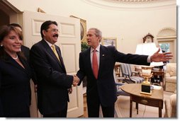 President George W. Bush welcomes President Manuel Zelaya and First Lady of Honduras, Xiomora Zelaya, to the Oval Office Monday, June 5, 2006. "We've had a very good discussion, as you would expect amongst friends," said President Bush. "We discussed our common interests, and one of our common interests is expanded commercial opportunity. And CAFTA gives us a chance to realize those opportunities. We talked about our common desire to make sure the democracies in the region are strong." White House photo by Eric Draper