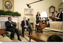 President George W. Bush and President Denis Sassou-Nguesso of the Republic of the Congo talk with the press during a meeting in the Oval Office Monday, June 5, 2006. "We had a very constructive discussion about a variety of issues," said President Bush. "We talked about our common commitment to help end the genocide in Darfur. I appreciate the President's leadership in helping negotiate a peace agreement, and I appreciate his leadership in working with the United Nations so we can get the AU forces blue-helmeted as quickly as possible."  White House photo by Eric Draper