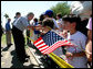 President George W. Bush greets a crowd during an unscheduled stop at a Laredo, Texas, elementary school after visiting the Laredo Border Patrol Sector Headquarters, Tuesday, June 6, 2006. White House photo by Eric Draper