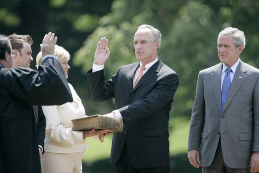 President George W. Bush stands with former Idaho Gov. Dirk Kempthorne as he is sworn-in as the new U.S. Secretary of Interior by Supreme Court Justice Antonin Scalia, left, Wednesday, June 7, 2006 on the South Lawn of the White House in Washington. Patricia Kempthorne holds the Bible during her husband’s swearing-in, joined by their children Heather Myklegard and son, Jeff Kempthorne. White House photo by Eric Draper