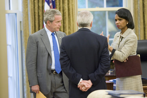 President George W. Bush talks with Secretary of State Condoleezza Rice and White House Chief of Staff Joshua Bolten in the Oval Office after receiving news of terrorist al Zarqawi's death in Iraq at 4:49 p.m. Wednesday, June 7, 2006. White House photo by Eric Draper