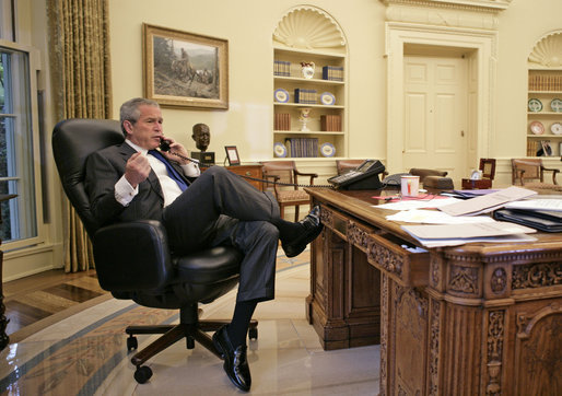 President George W. Bush talks with Prime Minister Nouri al-Maliki of Iraq regarding the death of terrorist al Zarqawi from the Oval Office Thursday morning, June 8, 2006. White House photo by Eric Draper