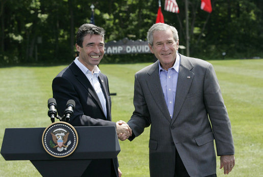 President George W. Bush and Prime Minister Anders Fogh Rasmussen of Denmark meet at Camp David Friday, June 9, 2006. White House photo by Eric Draper