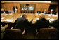 President George W. Bush speaks with his top advisors during a meeting Monday, June 12, 2006 at Camp David, Md., part of a two-day conference on Iraq. White House photo by Eric Draper