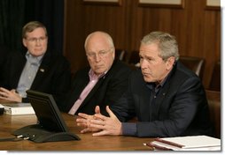 President George W. Bush gestures as he addresses his top advisors during an interagency team meeting on Iraq Monday, June 12, 2006 at Camp David, Md., part of a two-day conference on Iraq. Vice President Dick Cheney and National Security Council advisor Stephen Hadley are seen at left. White House photo by Eric Draper