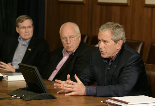 President George W. Bush gestures as he addresses his top advisors during an interagency team meeting on Iraq Monday, June 12, 2006 at Camp David, Md., part of a two-day conference on Iraq. Vice President Dick Cheney and National Security Council advisor Stephen Hadley are seen at left. White House photo by Eric Draper