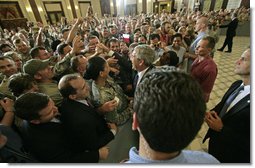 President greets U.S. troops and U.S. embassy personnel during his trip to Baghdad, Iraq, Tuesday, June 13, 2006. "This is a moment -- this is a time where the world can turn one way or the other, where the world can be a better place or a more dangerous place," said the President. "And the United States of America and citizens such as yourself are dedicated to making sure that the world we leave behind is a better place for all." White House photo by Eric Draper