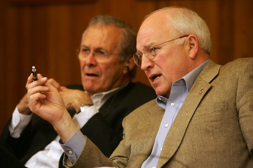 Vice President Dick Cheney talks with Secretary of Defense Donald Rumsfeld during a video teleconference from Camp David, Md. with President Bush and Iraqi Prime Minister Nouri al-Maliki in Baghdad, Tuesday, June 13, 2006. White House photo by David Bohrer