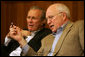 Vice President Dick Cheney talks with Secretary of Defense Donald Rumsfeld during a video teleconference from Camp David, Md. with President Bush and Iraqi Prime Minister Nouri al-Maliki in Baghdad, Tuesday, June 13, 2006. White House photo by David Bohrer