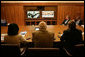 Vice President Dick Cheney, Secretary of Defense Donald Rumsfeld, right, and Secretary of State Condoleezza Rice, left, participate in a video teleconference from Camp David, Md., Tuesday, June 13, 2006 as President Bush meets Iraqi Prime Minister Nouri al-Maliki in Baghdad. The President expressed praise for Prime Minister Maliki's efforts in assembling a strong and diverse unity government in Iraq and said, "I want to thank you for giving me and my cabinet a chance to hear from you personally and a chance to meet the members of this team you've assembled. It's an impressive group of men and women, and if given the right help, I'm convinced you will succeed, and so will the world." White House photo by David Bohrer