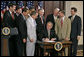 President George W. Bush signs S. 193, the Broadcast Decency Enforcement Act of 2005, in the Dwight D. Eisenhower Executive Office Building Thursday, June 15, 2006. White House photo by Eric Draper