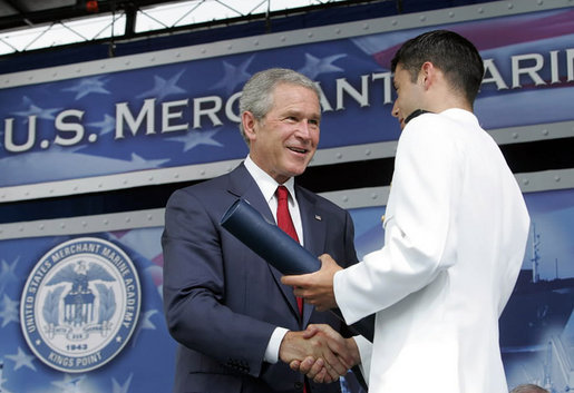 President George W. Bush greets graduates as they receive their degrees during the graduation ceremony at the United States Merchant Marine Academy at Kings Point, New York, Monday, June 19, 2006. White House photo by Kimberlee Hewitt