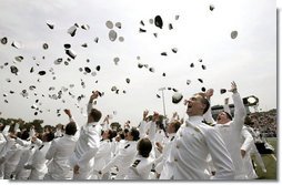 Graduates celebrate during their graduation ceremony at the United States Merchant Marine Academy at Kings Point, New York, Monday, June 19, 2006. White House photo by Kimberlee Hewitt