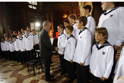 President George W. Bush meets members of the Vienna Boys Choir at the National Library at Hofburg Palace in Vienna, June 21, 2006. White House photo by Eric Draper