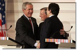 President George W. Bush shakes the hands of Chancellor Wolfgang Schuessel of Austria, center, and European Union President Jose Manuel Barroso following a press availability Wednesday, June 21, 2006, at the Hofburg Palace in Vienna. White House photo by Paul Morse