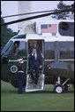 President George W. Bush and Laura Bush arrive via Marine One on the South Lawn of the White House Thursday, June 22, 2006, after a three-day European visit to Vienna and Budapest. White House photo by Kimberlee Hewitt