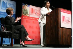 Mrs. Laura Bush applauds Caitlyn Clarke, high school Student of the Year for Jefferson Parish Public School System, Monday, June 26, 2006, as Miss Clarke speaks of her passion for reading before introducing Mrs. Bush during the 2006 American Library Association Conference in New Orleans, Louisiana.  White House photo by Shealah Craighead