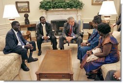 President George W. Bush meets with the National Endowment for Democracy award recipients in the Oval Office Tuesday, June 27, 2006. From left, they are Alfred Taban of Sudan, Dr. Reginald Matchaba-Hove of Zimbabwe, Immaculee Birhaheka of the Democratic Republic of the Congo and Zainab Hawa Bangura of Sierra Leone. White House photo by Kimberlee Hewitt