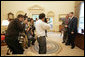 President George W. Bush meets with U.S. Army Staff Sergeant Christian Bagge, 23, of Eugene, Ore., in the Oval Office Tuesday, June 27, 2006. Mr. Bagge lost both legs to a roadside bomb in Iraq while serving in Operation Iraqi Freedom. After their meeting, the two ran together on the South lawn. White House photo by Eric Draper