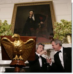 President George W. Bush and Japanese Prime Minister Junichiro Koizumi exchange toasts Thursday evening, June 29, 2006, during an official dinner in the State Dining Room at the White House in honor of the Prime Minister’s visit to the United States. White House photo by Eric Draper