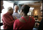 President George W. Bush stands with his arm around Dr. Benjamin Hooks, Memphis resident and former director of the NAACP, during a tour Friday, June 30, 2006, of the National Civil Rights Museum in Memphis. Joining them is Gwen Harmon, marketing director of the museum that is built around the Lorraine Motel, site of the 1968 assassination of civil rights leader Dr. Martin Luther King, Jr. The stop came during a visit to Memphis by the President with Prime Minister Junichiro Koizumi of Japan. White House photo by Eric Draper