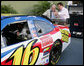 Vice President Dick Cheney is shown the National Guard NASCAR racing car by former NASCAR driver and Winston Cup champion Darrell Waltrip Saturday, July 1, 2006, prior to the start of the 2006 Pepsi 400 race at Daytona International Speedway in Daytona, Fla. White House photo by David Bohrer