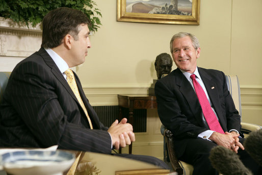 President George W. Bush and Georgian President Mikhail Saakashvili talk to the press in the Oval Office Wednesday, July 5, 2006. "He believes in the universality of freedom. He believes that democracy is the best way to yield the peace. The Georgian government and the people of Georgia have acted on those beliefs," said President Bush. "I want to thank you for your contribution in Iraq, to help the Iraqi people realize the great benefits of democracy." White House photo by Kimberlee Hewitt