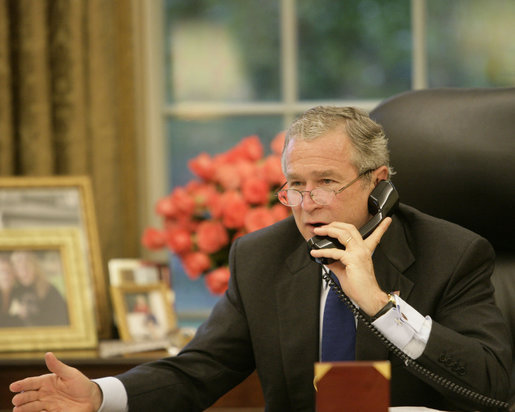 President George W. Bush speaks to Russian President Vladimir Putin during a morning telephone call Thursday, July 6, 2006, from the Oval Office of the White House. White House photo by Kimberlee Hewitt