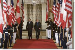 President George W. Bush and Prime Minister Stephen Harper of Canada hold a joint press conference in the East Room Thursday, July 6, 2006. "I'm impressed by his leadership style," said President Bush. "I appreciate the fact that he doesn't mince words, he tells me what's on his mind and he does so in a real clear fashion." White House photo by Kimberlee Hewitt