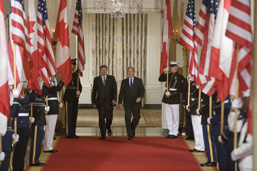 President George W. Bush and Prime Minister Stephen Harper of Canada hold a joint press conference in the East Room Thursday, July 6, 2006. "I'm impressed by his leadership style," said President Bush. "I appreciate the fact that he doesn't mince words, he tells me what's on his mind and he does so in a real clear fashion." White House photo by Kimberlee Hewitt