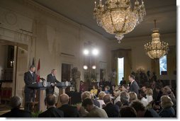 President George W. Bush and Canadian Prime Minister Stephen Harper talk with the media during a joint press conference in the East Room Thursday, July 6, 2006. "We've had some disputes in the past, trade disputes. That's what you expect when you have a lot of trade," said President Bush. "And probably the most nettlesome trade dispute was softwood lumber. And I appreciate the Prime Minister's leadership in helping us resolve this issue." 