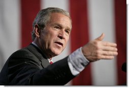 President George W. Bush gestures as he addresses a news conference at the Museum of Science and Industry in Chicago, Friday, July 7, 2006, speaking on the economy, immigration reform and security issues. White House photo by Eric Draper