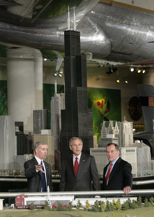 President George W. Bush is joined by Chicago Mayor Richard M. Daley, right, and Kurt Haunfelner, vice president of exhibits, left, as he is given a tour through the Museum of Science and Industry in Chicago, Friday, July 7, 2006, following his news conference at the museum. White House photo by Eric Draper