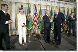 President George W. Bush congratulates Henry Paulson at his swearing in as the Secretary of Treasury at the Department of the Treasury Monday, July 10, 2006. "He has an intimate knowledge of global markets. He will work to keep this economy of ours competitive and growing, and he will work to ensure fair treatment for America's goods and services across the world," said President Bush in his remarks. White House photo by Eric Draper