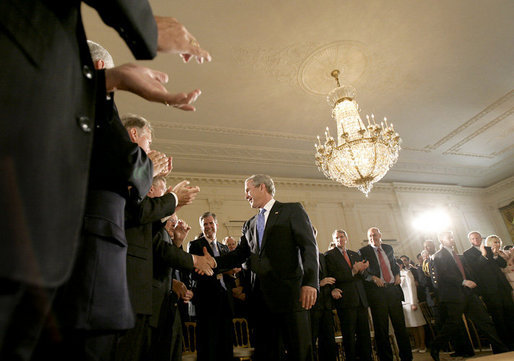 President George W. Bush greets the audience after delivering remarks on the economy and budget, Tuesday, July 11, 2006, in the East Room at the White House. White House photo by Eric Draper