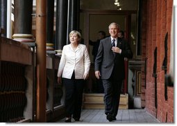 Chancellor Angela Merkel and President George W. Bush walk to their meeting after the arrival ceremony in Stralsund, Germany, Thursday, July 13, 2006. White House photo by Paul Morse