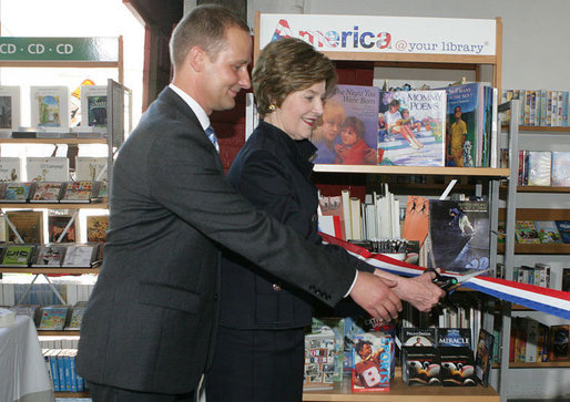 Mrs. Laura Bush participates in a ribbon cutting, assisted by Michael Gawenda, director of the City Library of Stralsund, Thursday, July 13, 2006, at the Stralsund Children’s Library in Stralsund, Germany, to open the exhibit America@yourlibrary. The America@yourlibrary is a new initiative to develop existing and new partnerships between German public libraries and the U.S. Embassy and Consulate Resource Centers. White House photo by Shealah Craighead